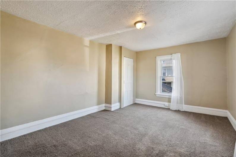 2nd bedroom with beautiful tall ceiling & trimwork.