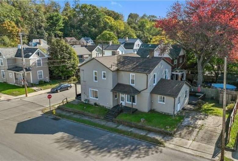 Aerial view showing corner lot and off street parking.