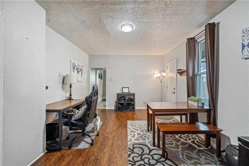 Enjoy updated laminate flooring and modern color scheme in the formal dining room or den whatever your needs may be.