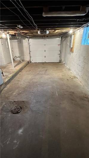 Garage has enough room for a small car.
