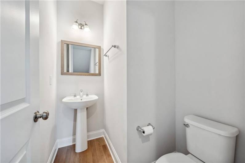 Main floor powder room, off of kitchen
