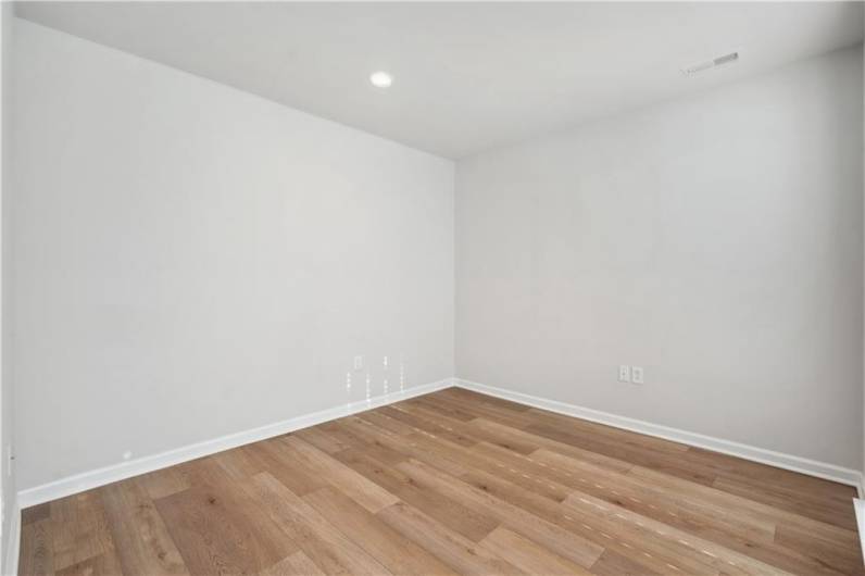Ground level bonus space or office, immediately to the right when walking through the front door.