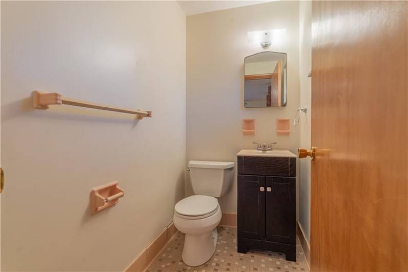 The primary bedroom features an en-suite half bath.