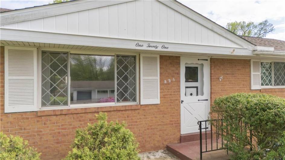 The front entry includes a storm door.