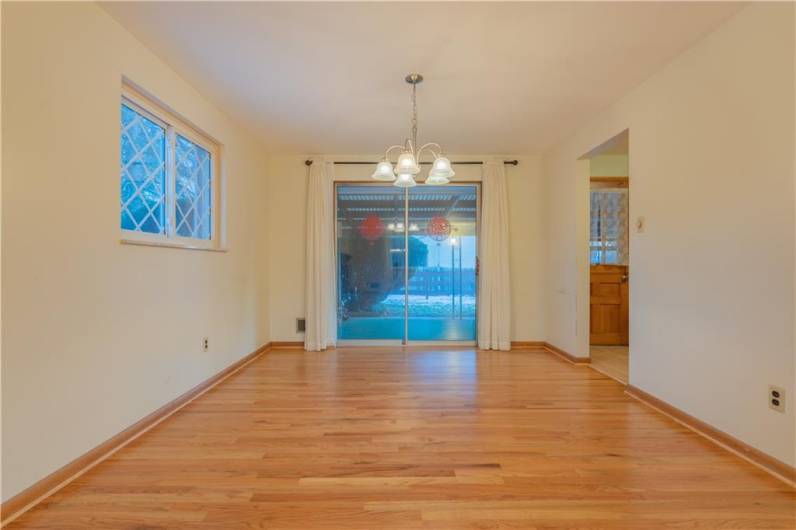 The dining room features sliding doors that lead to the private covered patio.