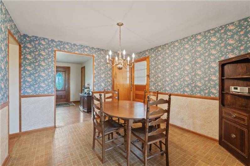 Chair rail & vintage wallpaper makes this room pop!!