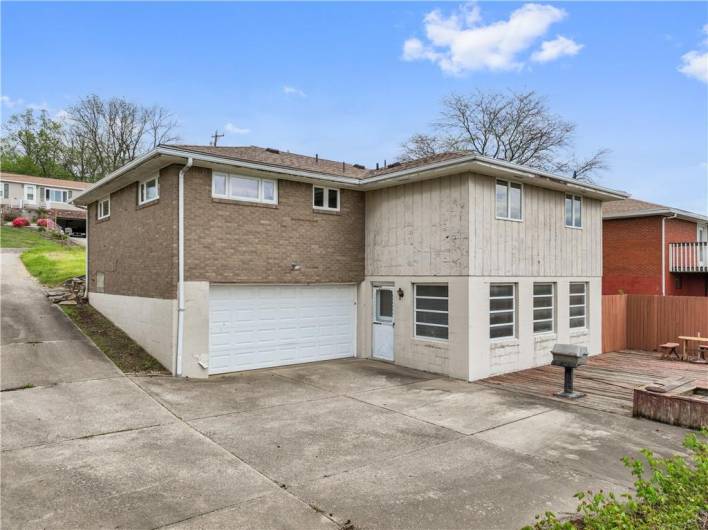 2-car garage, ground-level deck, & cool sun room...