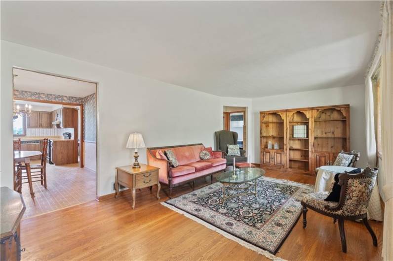 The large living room has fabulous HW floors...
