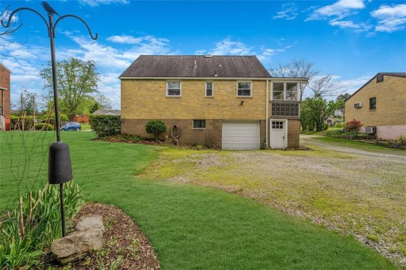 Back of Home Large Driveway and 1 car garage