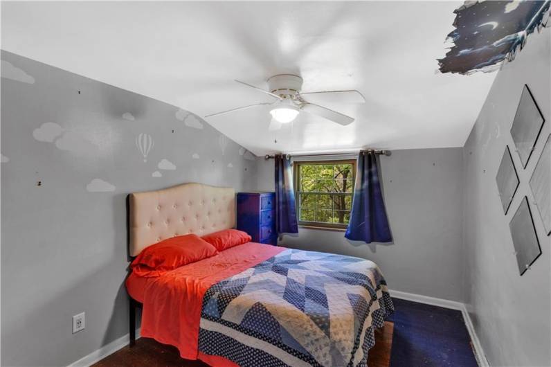 This bedroom is one of three that this home offers.