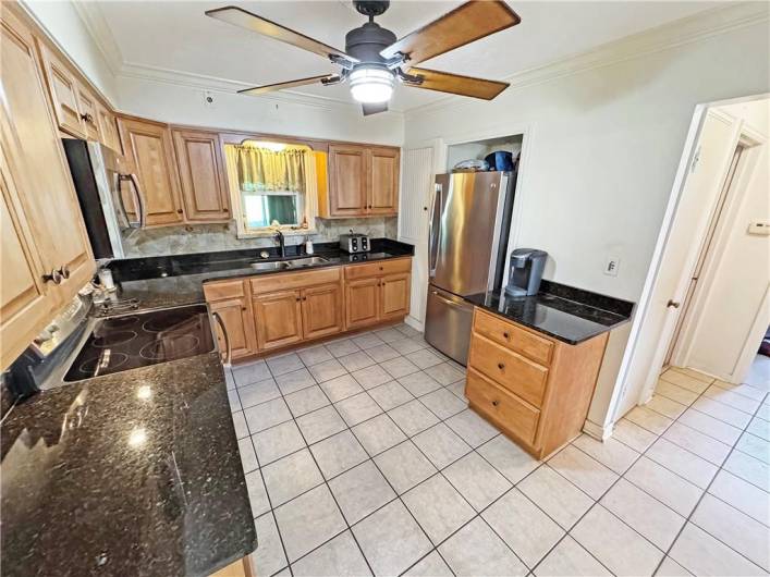 Just a few steps away is a walk-in closet for storage or a pantry.