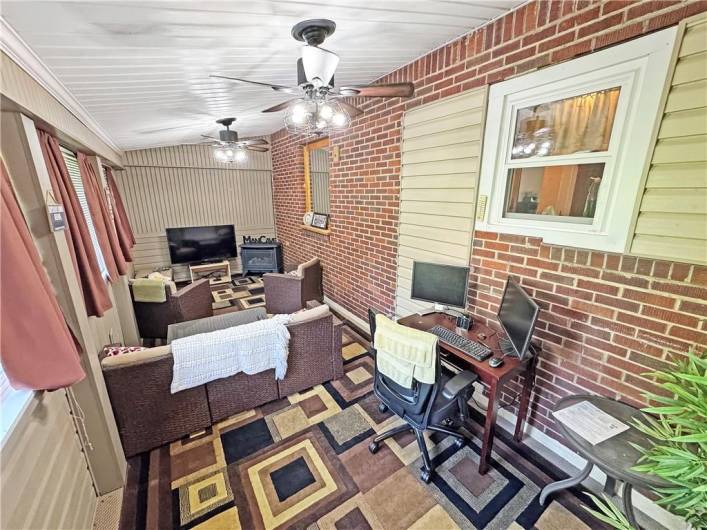 Enclosed rear porch.  Stove does not stay but there is a natural gas line.