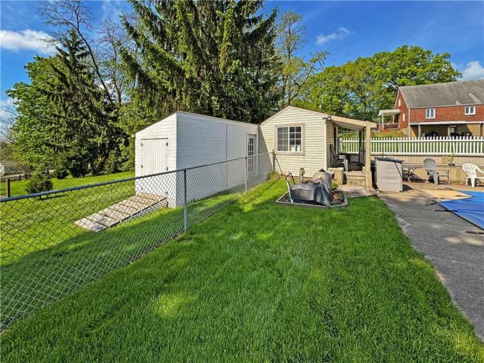 Storage shed and pool house for additional storage.