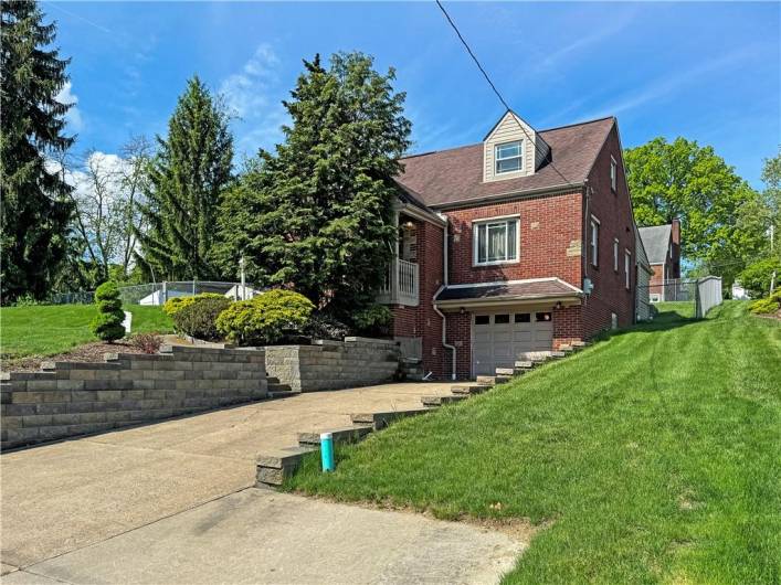 Plenty of parking in the driveway, newer retaining walls.