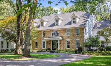 This French Provincial gem is highlighted by professional landscaping and lighting.