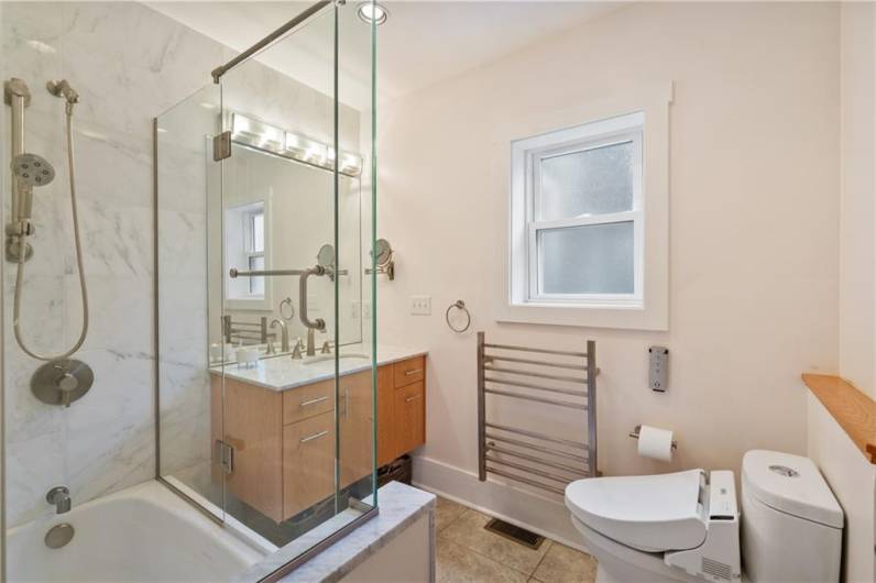This tastefully updated bath is located on the upper level.