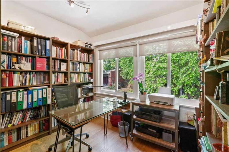 The current owner (a book lover!) uses the second bedroom upstairs as a study/library