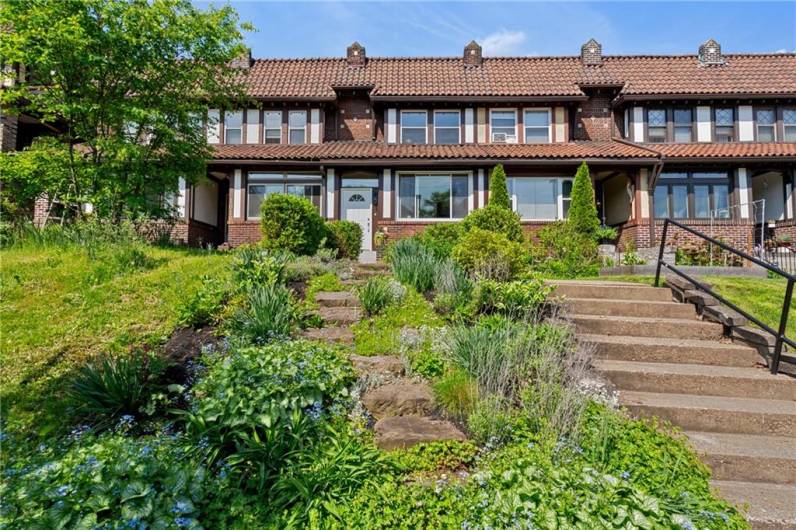 A professionally landscaped perennial garden brings year round low-maintenance delight
