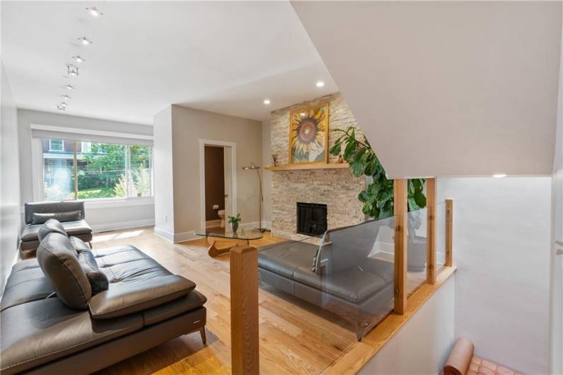 The powder room is conveniently located off the living room. Note the beautiful wide plank white oak floors throughout the main and upper levels