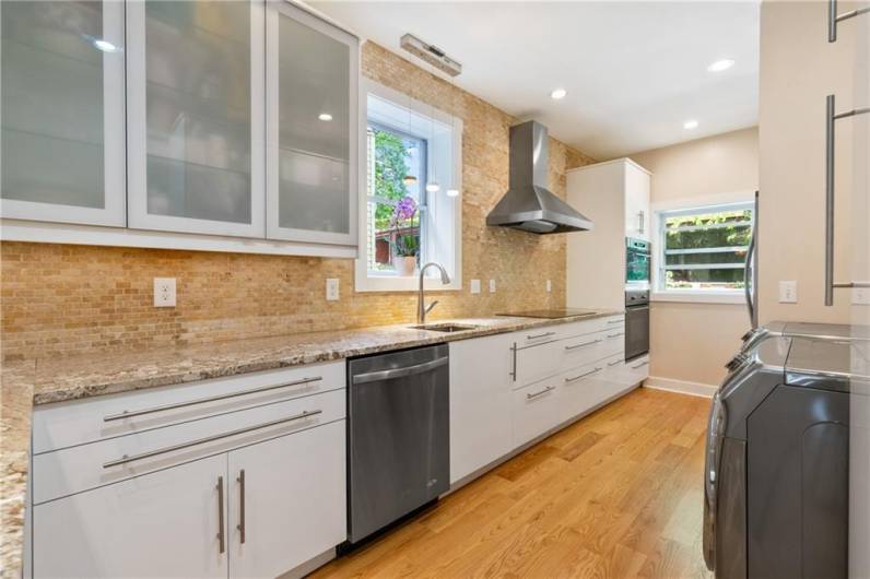 So much counter space and cabinetry! Whether you love to whip up gourmet meals or prefer to just make coffee and enjoy takeout, this kitchen makes it a joy to prepare family meals and host big dinners