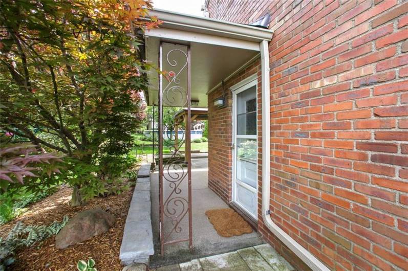 Door from kitchen leading to back yard