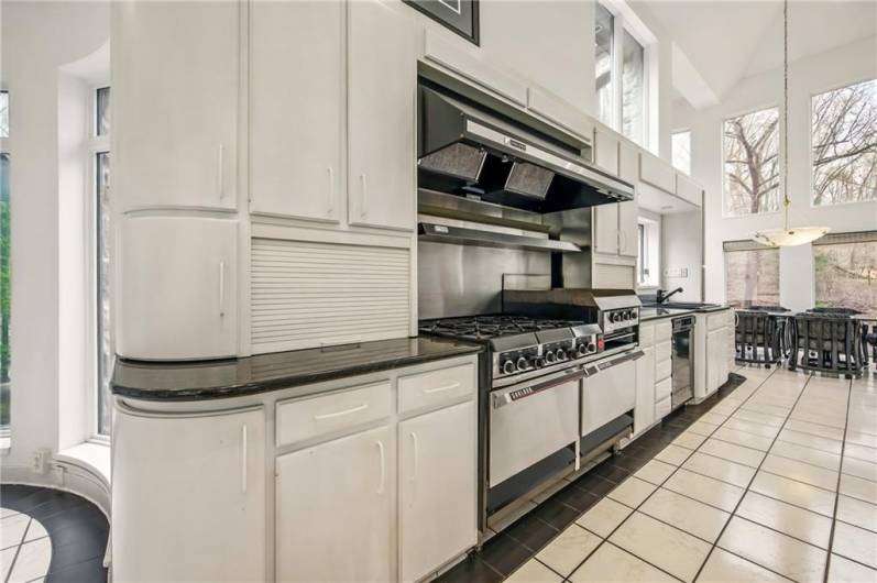 For the serious entertainer or culinary enthusiast: a commercial-grade kitchen complemented by the rare luxury of dual walk-in coolers, thoughtfully fitted with shelving