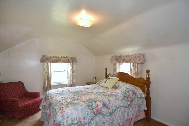 14 x 10  Both front & side windows for lots of light, neutral walls, hardwood under carpeting
