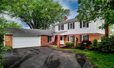 Beautiful curb appeal at 2446 Pin Oak Place, a classic center hall colonial home! Note the covered entry to greet your guests.