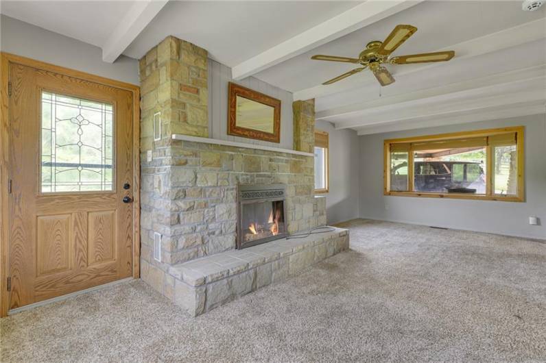 23x11 Living room with wood burning fireplace.