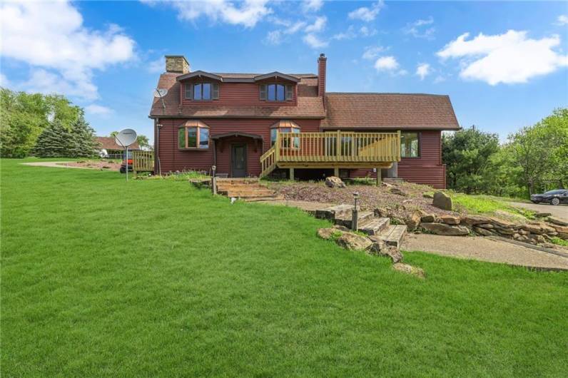 Large 16x16 deck off the back of the house overlooking the yard.