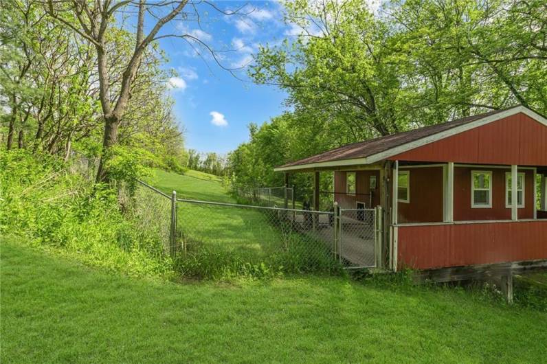 Double sided dog house/kennel with seperate gated runs.