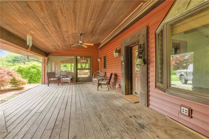 Expansive 37x15 front porch looking out to the stately driveway.