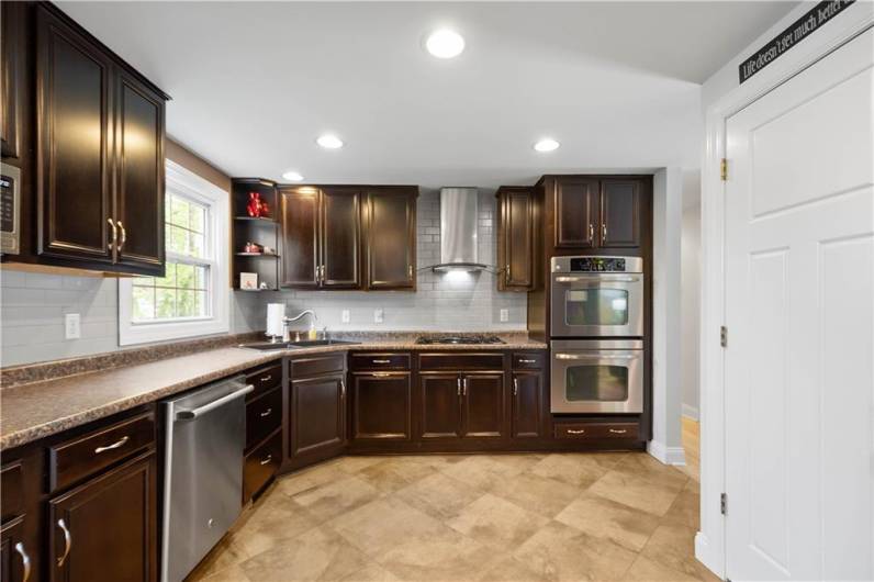 You Will Love the GE Stainless Appliances Including a Gas Stove and Double Ovens