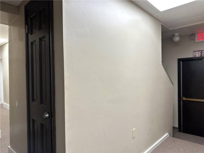 Rear Exit Door and Stairway to Upper Level