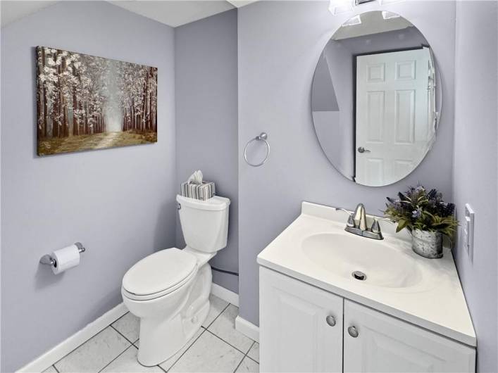 Powder room located off the game room.