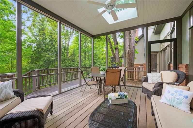 Screened in porch with lovely garden/wooded view.