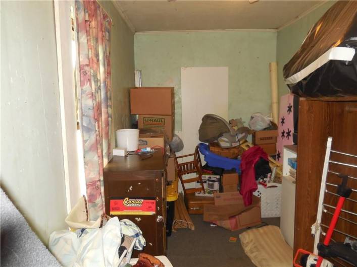 Captive bedroom has window and closet.