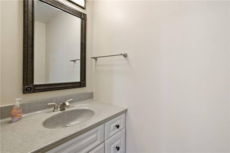 A convenient half bath is located on the main level.