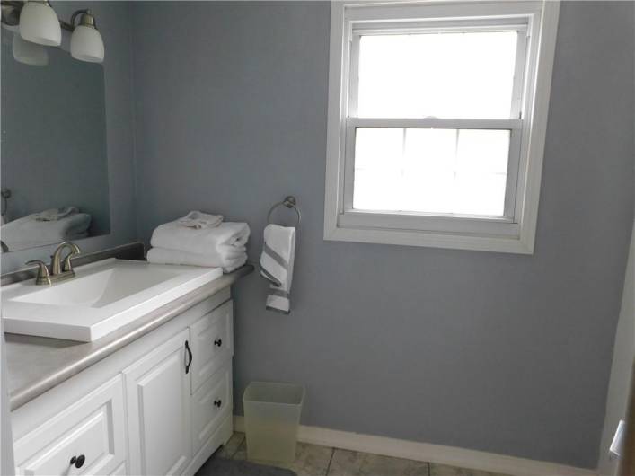 Nicely updated bathroom with a window.
