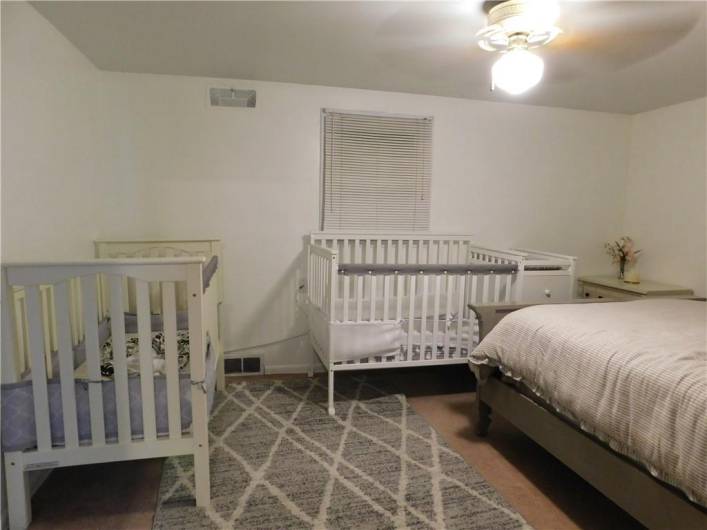 Bedroom # 3 with triple windows, closet, , and ceiling light.