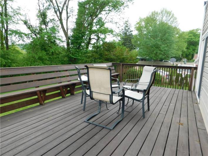 Large back deck for entertaining guests and has a stairway to the back yard.