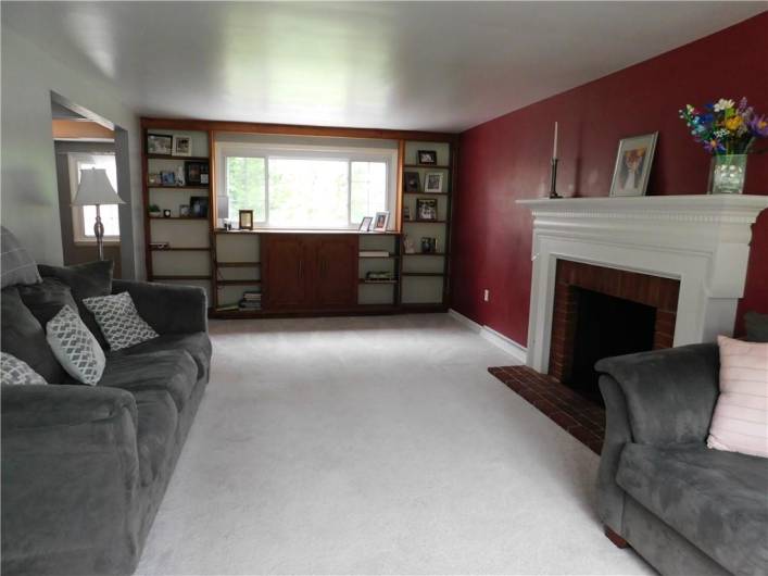 Spacious Living Room with built in bookshelves.
