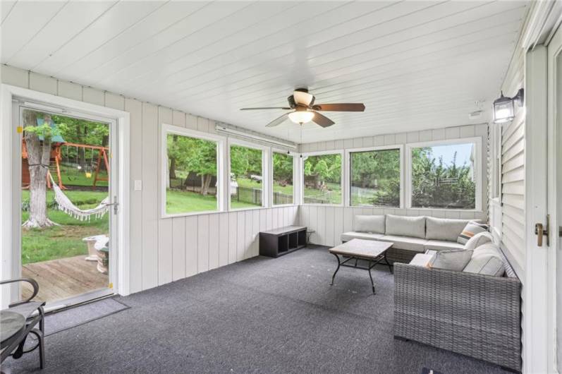Wow, this is a bonus room! Huge space to enjoy the outdoors while under cover.  Add a TV and watch your favorite shows!