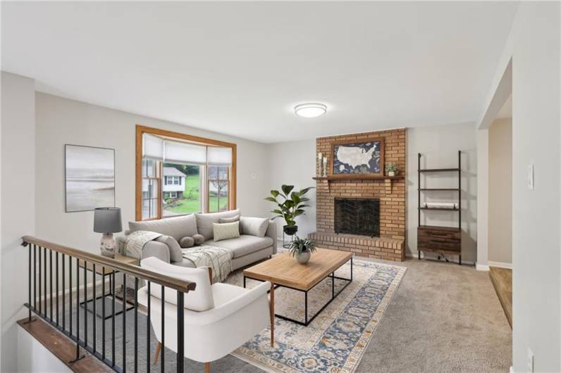 Enjoy Spacious Family Room on Main Level for Enjoying watching TV or enjoying the warmth of the Fireplace.