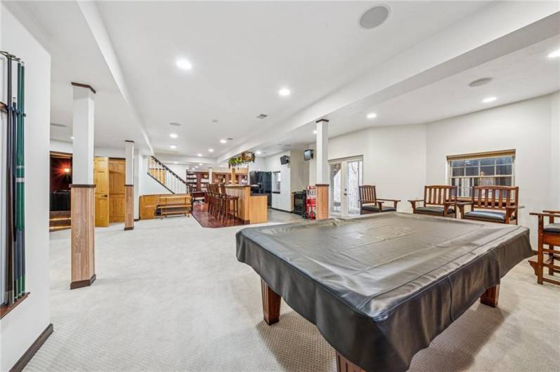 Lower level game room with bar, stools and sauna