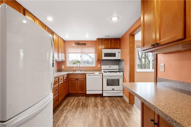 Who wouldn't enjoy cooking in this kitchen?! Fully updated with a gas stove, beautiful maple cabinetry, all in a great work triangle!
