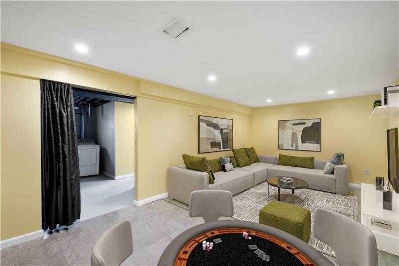 Downstairs is a nicely finished game room that is the same size as the living room above it.