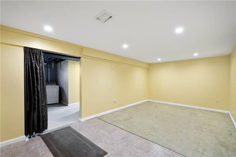 The owners made a good decision with the flooring -- carpet in the area where you would have a sofa, and an easy to clean surface for the area you would typically walk through if you came in through the garage.