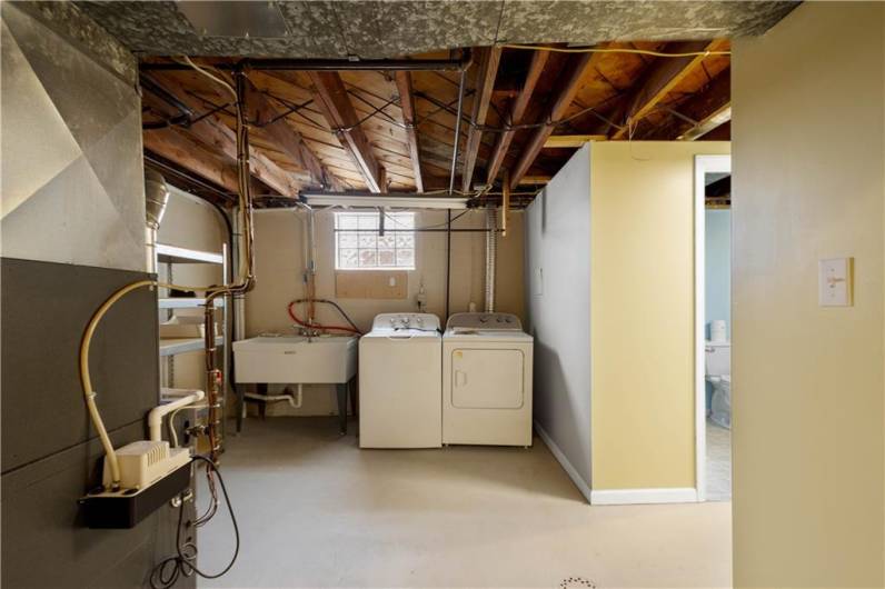 The mechanicals are all in one place and the washer and dryer are included in the sale. Nice oversized washtub and some extra storage.