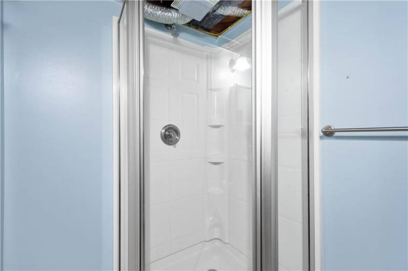 This corner shower doesn't take up a lot of space but gets the job done!